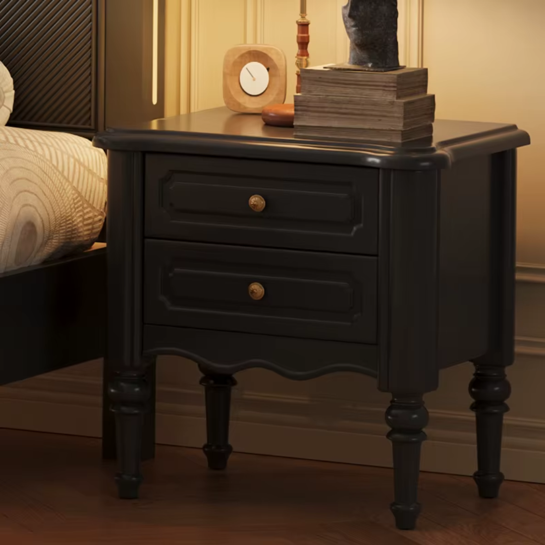 Black Contemporary Bedside Table featured next to a bed 