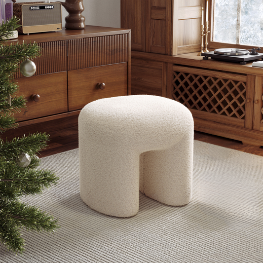 Boucle Fabric Teddy Pouffe positioned in a mid century style living room