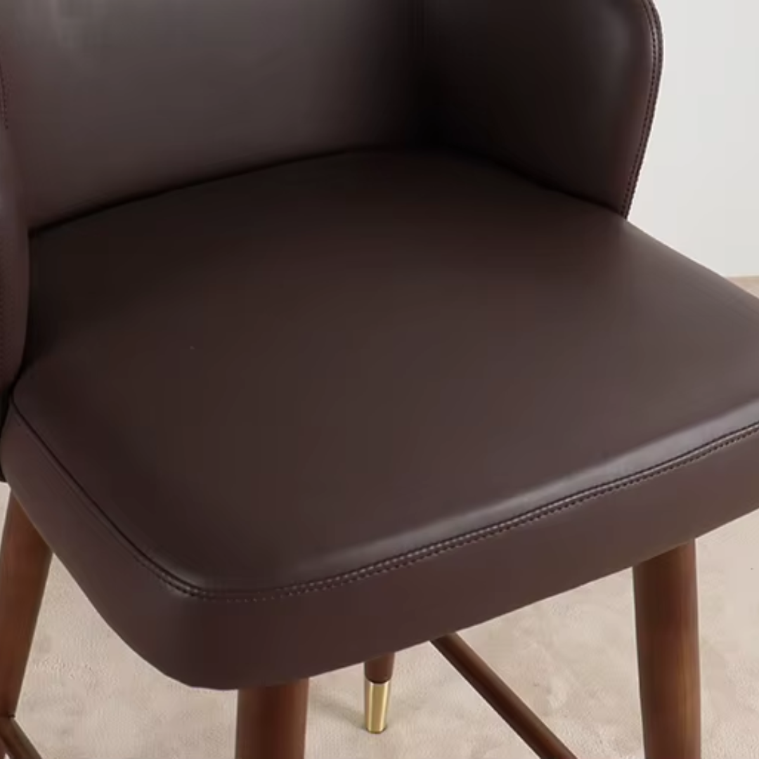 Brown Bar Stool With Back Leather close up pf the leather padded seat