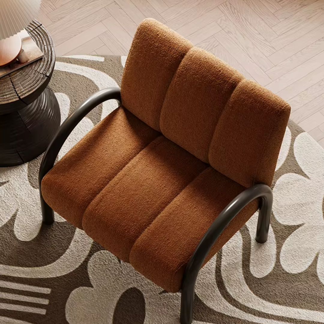 Close-up of fabric on burnt orange armchair