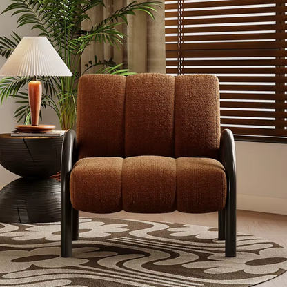 Side view of burnt orange armchair with armrests