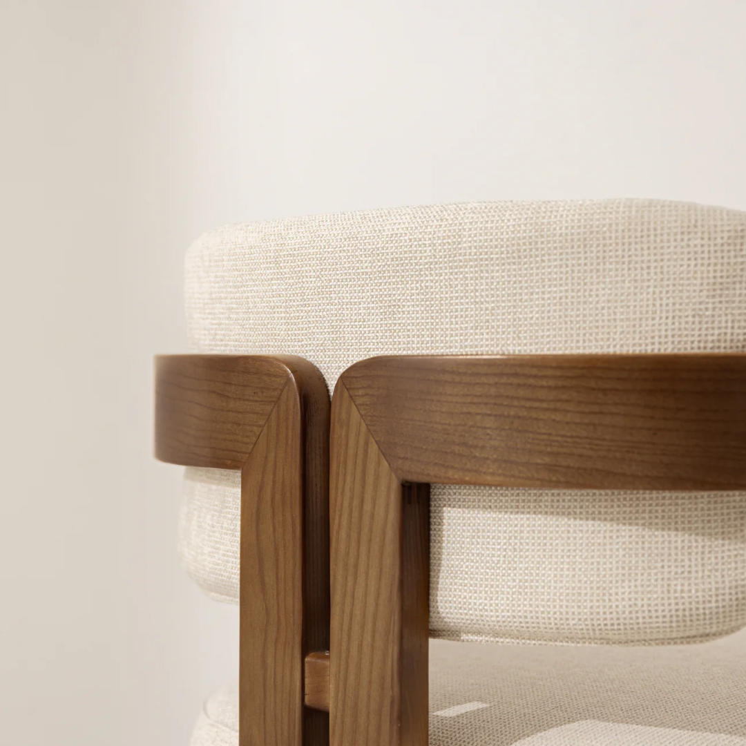 Smooth natural finish on curved wood dining chair