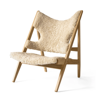 Faux Sheepskin Knitted Lounge Chair against a white background