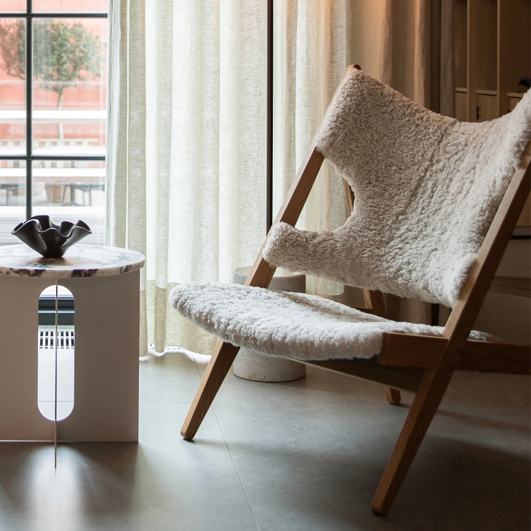 Faux Sheepskin Knitted Lounge Chair in a reading corner side view