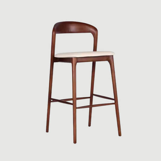 Side view of wooden bar stool with cushioned seat