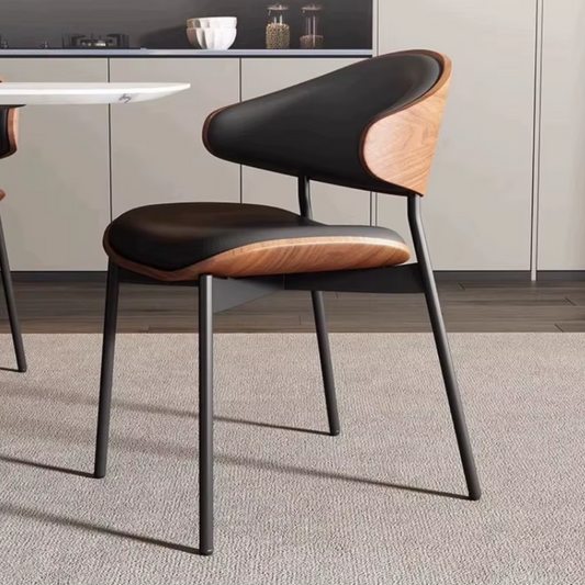 Side view of a walnut frame leather dining table chair featuring a sleek design and premium leather design