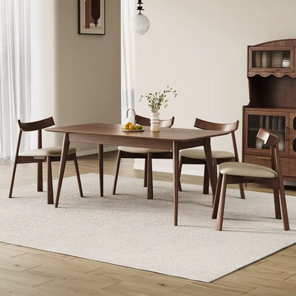 A dining table set featuring multiple wood frame upholstered leather dining chairs