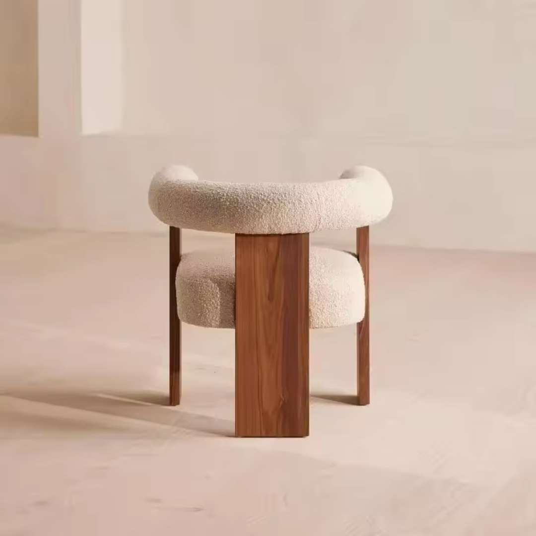 Back view of wood frame white boucle dining chair