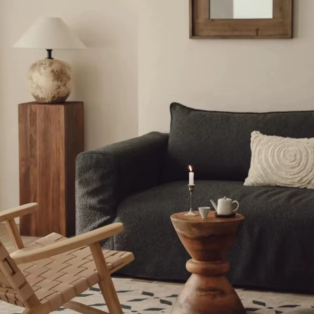 Wooden Block Side Table styled next to a black sofa