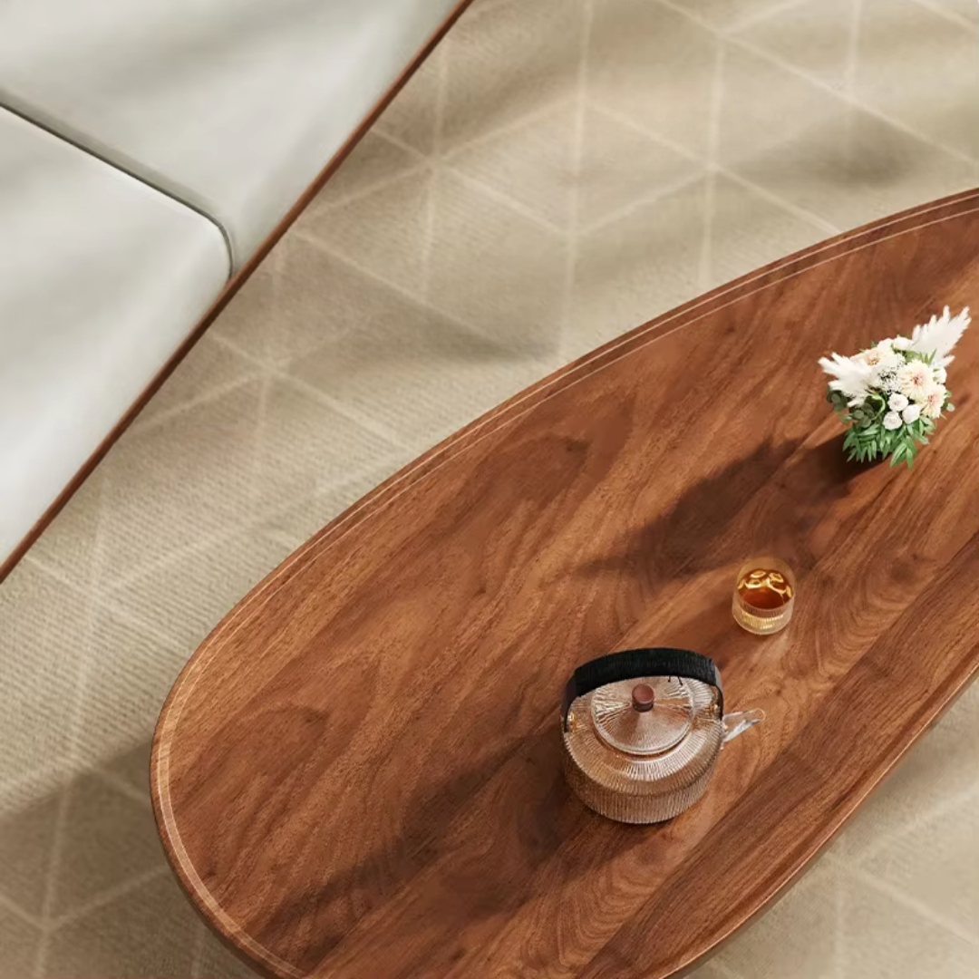 Living room featuring wooden oval coffee table with black legs