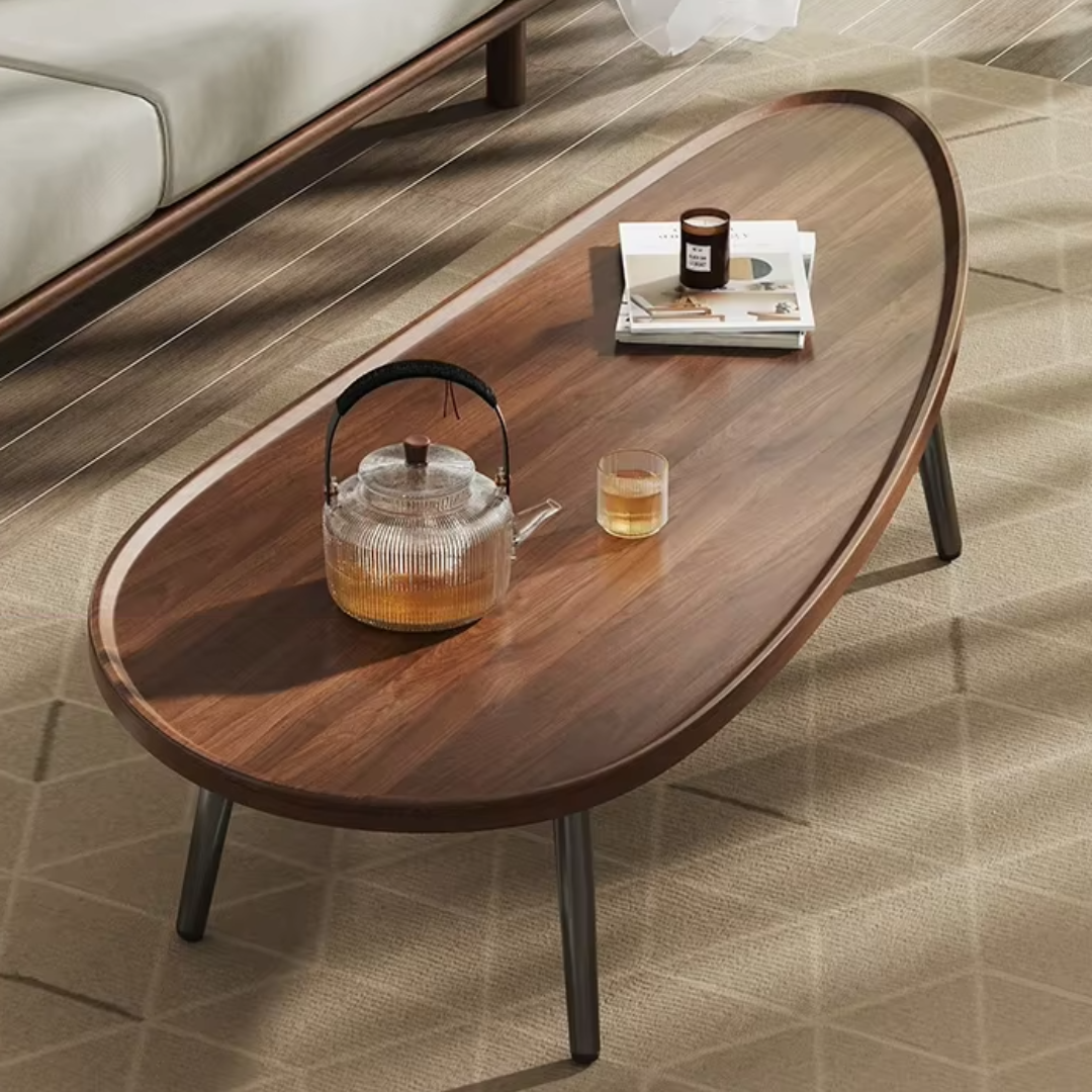 Front view of wooden oval coffee table with black legs