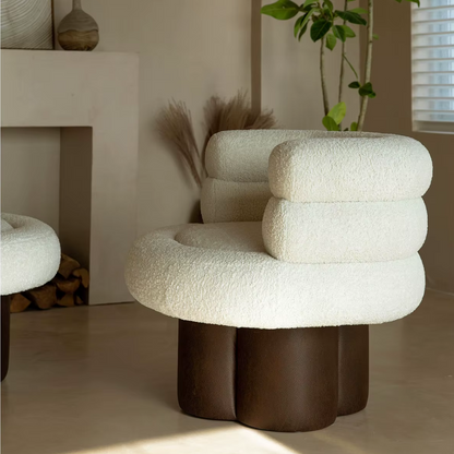 Close-up of white boucle fabric on barrel chair